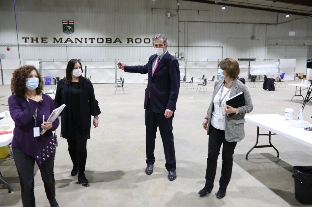 CP
Premier Brian Pallister tours the Brandon COVID-19 immunization supersite last week. On the weekend, 558 text messages were sent to health-care workers incorrectly directing them to the Winnipeg site at the convention centre instead of the Keystone Centre in Brandon. (Matt Smith / The Canadian Press files)