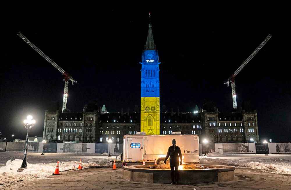 The Canadian Press
The Peace Tower on Parliament Hill is lit up with the colours of Ukraine's national flag in a show of support following Russia's invasion, in Ottawa, Sunday, Feb. 27, 2022. (Justin Tang / The Canadian Press)