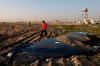 In this Jan. 8, 2020, file photo a rescue worker searches the scene where a Ukrainian plane crashed in Shahedshahr southwest of the capital Tehran, Iran. Foreign Minister Francois-Philippe Champagne says Iran doesn't have experts who can analyze the data recorders from a civilian airliner it shot down last month and it's time to send the black boxes out of the country. THE CANADIAN PRESS/AP/Ebrahim Noroozi, File