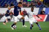 Montreal Impact's Michael Azira (32) defends New England Revolution's Juan Agudelo, left, during the second half of an MLS soccer game in Foxborough, Mass., Wednesday, April 24, 2019. THE CANADIAN PRESS/AP-Stew Milne