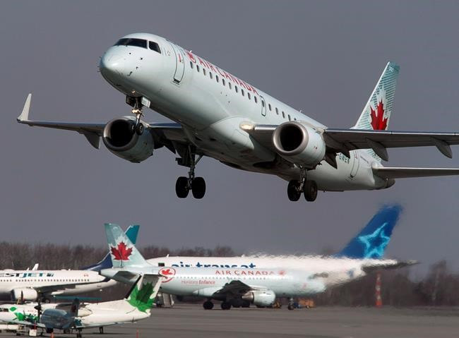 An Air Canada jet takes off from Halifax Stanfield International Airport in Enfield, N.S. on Thursday, March 8, 2012. Air Canada says travellers can now change their ticket up to 24 hours before their flight without incurring a rebooking fee, the airline's latest response to the novel coronavirus outbreak.THE CANADIAN PRESS/Andrew Vaughan