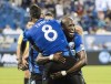 Montreal Impact's Rod Fanni, right, celebrates with teammate Saphir Taider (8) after scoring against the New York Red Bulls during first half MLS soccer action in Montreal on Saturday, September 1, 2018. The Montreal Impact have signed centre back Rod Fanni to a one-year contract. THE CANADIAN PRESS/Graham Hughes