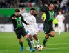 Wolfsburg's Renato Steffen, left, and Marcel Tisserand, battle for the ball with Gent's Jonathan David during the Europa League Group I soccer match between Vfl Wolfsburg and KAA Genk in Wolfsburg, Germany, Thursday, Nov. 7, 2019. Teenage forward Jonathan David, who has scored a Canadian-record 28 goals for club and country this year, has been named Canadian Player of the Year. THE CANADIAN PRESS/Peter Steffen/dpa via AP