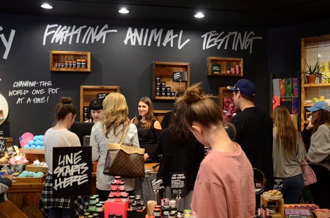 Holiday shoppers browse at Lush, a cosmetics store at Cherry Creek Shopping Center in Denver, Colo. on November 24, 2017. Cosmetics company LUSH has launched a campaign calling on people to pressure Parliament to back out of an agreement with the U.S. that governs refugee claims. It's part of a broader effort by the U.K.-based company to draw attention to the impacts of major changes to U.S. immigration policy. THE CANADIAN PRESS/AP, Tatiana Flowers