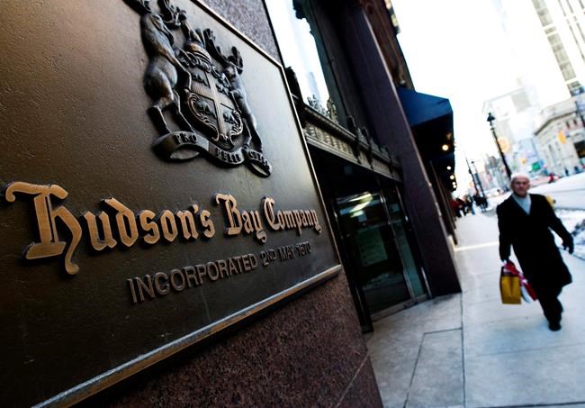 A person walks past the Hudson's Bay Company sign in downtown Toronto on Wednesday, Feb. 4, 2009. A minority shareholder filed a lawsuit today to block a bid to take Hudson's Bay Co. private. Ortelius Advisors L.P. says it filed a lawsuit at the Ontario Superior Court of Justice against Hudson's Bay Co. and the group making the privatization bid, which is led by HBC's executive chairman Richard Baker. THE CANADIAN PRESS/Nathan Denette