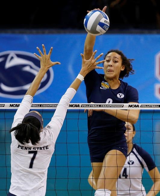 BYU's Alexa Gray (9) hits over Penn State's Nia Grant (7) during the NCAA women's volleyball tournament championship match in Oklahoma City, Saturday, Dec. 20, 2014. Canadian volleyball player Gray feels extra motivation in an upcoming Olympic qualification tournament. THE CANADIAN PRESS/AP/Sue Ogrocki