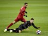 D.C. United forward Paul Arriola (7) goes down as Toronto FC midfielder Nicolas Benezet (7) chases the ball during first half MLS playoff soccer action in Toronto on Saturday, Oct. 19, 2019. Toronto FC has shipped the rights to French winger Nicolas Benezet to the Colorado Rapids in exchange for US$50,000 general allocation money. THE CANADIAN PRESS/Frank Gunn