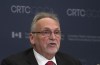 CRTC Chair Ian Scott is seen at the start of the first day of hearings on mobile wireless service, Tuesday February 18, 2020 in Gatineau, Que. The head of Atlantic Canada's largest independent phone and cable company says it has put on hold all upgrades and expansions of its wireless networks because of uncertainty about what prices it will be able to charge in future. THE CANADIAN PRESS/Adrian Wyld