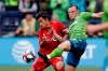 Seattle Sounders' Jordan Morris, right, kicks the ball ahead of Toronto FC's Tsubasa Endoh, Sunday, Nov. 10, 2019, during the first half of the MLS Cup championship soccer match in Seattle. Toronto FC will have to wait until July 18 to have another crack at the MLS champion Seattle Sounders. THE CANADIAN PRESS/AP-Elaine Thompson