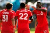 Toronto FC's Jozy Altidore (17) celebrates Richie Laryea's (22) goal against the San Jose Earthquakes during the second half on an MLS soccer game in San Jose, Calif., on February 29, 2020. THE CANADIAN PRESS/AP, Jed Jacobsohn