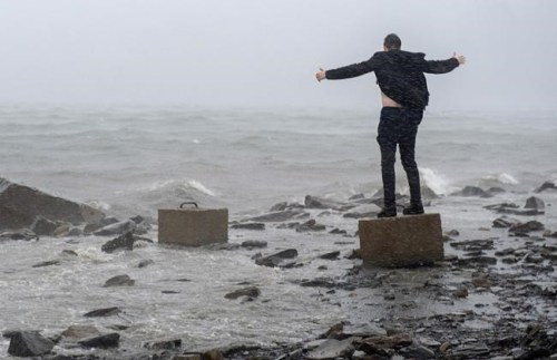 An unidentified man watches the impact of hurricane Dorian along the Halifax harbour in Dartmouth, Nova Scotia, Canada, on Saturday, September 7, 2019. The Globe and Mail leads the nominations for the 2019 National Newspaper Awards, with 19 of the 63 finalists in the running. La Presse racked up 10 nominations, and the Toronto Star received seven, including a joint submission between the two papers. The Canadian Press earned three nominations in the general news photo, feature photo and sports photo categories. THE CANADIAN PRESS/Andrew Vaughan
