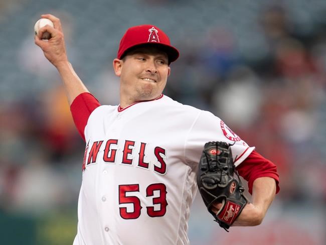 Los Angeles Angels starting pitcher Trevor Cahill delivers a pitch during the first inning of a baseball game against the Minnesota Twins in Anaheim, Calif., on May 21, 2019. The San Francisco Giants signed veteran right-hander Trevor Cahill to a minor league contract Wednesday, and Cahill took part in the day's first spring training workout for pitchers and catchers. THE CANADIAN PRESS/AP, Kyusung Gong
