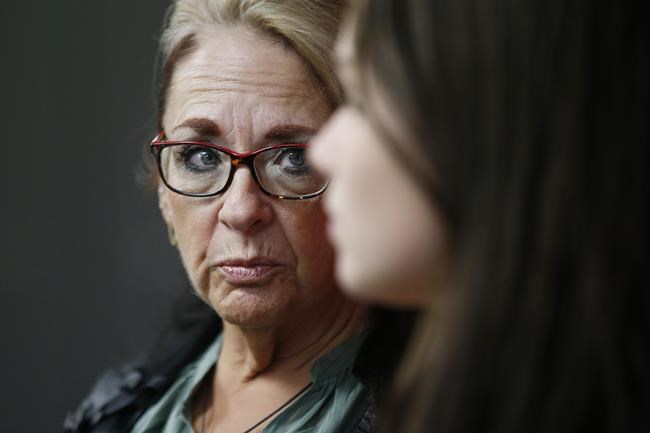 Manitoba Government Employee Union President Michelle Gawronsky listens during a press conference in Winnipeg on November 27, 2019. The union that represents workers at casinos in Winnipeg says its members are being told they will only be paid until the end of the month. The casinos are being closed due to the COVID-19 pandemic, and the Manitoba Government and General Employees Union says workers are being told they will have to use up leave time after March 31 and face temporary layoffs after that. Union president Michelle Gawronsky the province should step in and help the workers at the government-run casinos. THE CANADIAN PRESS/John Woods
