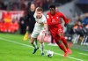 Leipzig's Dani Olmo, left, and Bayern's Alphonso Davies challenge for the ball during the German Bundesliga soccer match between Bayern Munich and RB Leipzig at the Allianz Arena in Munich, Germany, Sunday, Feb. 9, 2020. Canadian international Alphonso Davies left Bayern Munich's training session early Wednesday with what the club called 