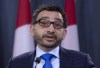 Omar Alghabra, Parliamentary Secretary to the Prime Minister attends a news conference on the Iran plane crash, Wednesday January 15, 2020 in Ottawa. The federal government says it will contribute to a national campaign to help cover funeral costs for families affected by the deadly plane crash in Iran earlier this month. THE CANADIAN PRESS/Adrian Wyld