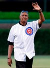 Former Chicago Cub Ferguson Jenkins waves to fans before a baseball game between the Pittsburgh Pirates and the Chicago Cubs Wednesday, Aug. 31, 2016, in Chicago. Jenkins was thrilled to hear the news Tuesday night that fellow Canadian Larry Walker had been elected into the National Baseball Hall of Fame in Cooperstown, N.Y. THE CANADIAN PRESS/AP/Nam Y. Huh