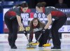 Ontario skip Rachel Homan delivers a rock as lead Lisa Weagle, left, and second Joanne Courtney sweep in championship pool action against the Wild Card team at the Scotties Tournament of Hearts at Centre 200 in Sydney, N.S. on Thursday, Feb. 21, 2019. Weagle was shocked to receive word this week that Team Homan would no longer be needing her services. THE CANADIAN PRESS/Andrew Vaughan