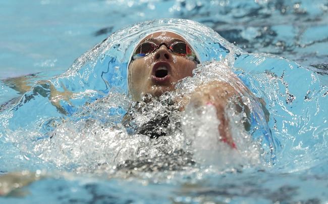 Canada's Kylie Masse swims in her heat of the women's 100m backstroke at the World Swimming Championships in Gwangju, South Korea, on July 22, 2019. The Canadian Olympic and Paralympic swimming trials have been postponed due to concerns over the spread of COVID-19. THE CANADIAN PRESS/AP, Lee Jin-man