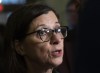 Quebec Health Minister Danielle McCann responds to reporters questions before entering a government caucus meeting Tuesday, February 18, 2020 at the legislature in Quebec City. Quebec public health officials are reporting the province's first presumptive case of the new coronavirus, dubbed COVID-19. THE CANADIAN PRESS/Jacques Boissinot