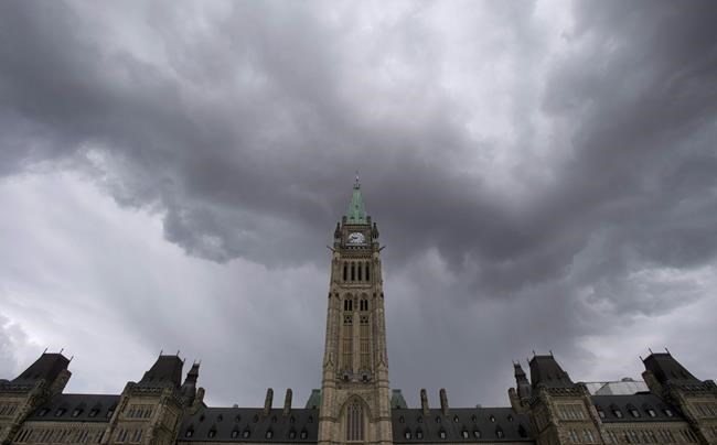Dark clouds pass by the Parliament buildings in Ottawa on Thursday, May 19, 2016. In war, as the saying goes, truth is the first casualty. In a global pandemic, it seems trust doesn't fare too well either. At a moment in history marked by social-media snark and diminished public faith in long-standing institutions like government, the mainstream media and the post-war pillars of the rules-based international order, the world is dealing with a critical shortage of both at the worst possible time. THE CANADIAN PRESS/Adrian Wyld
