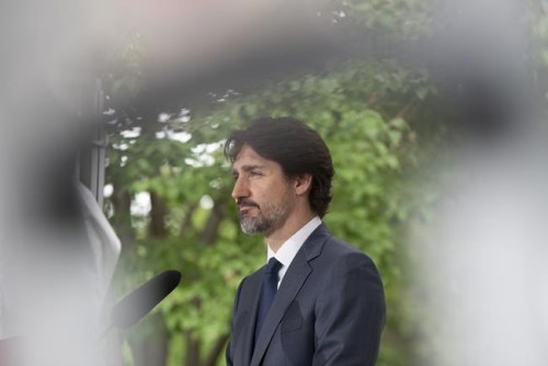 Prime Minister Justin Trudeau responds to a question during a news conference outside Rideau Cottage in Ottawa, Thursday, June 25, 2020. Trudeau says Canadian companies are now producing so much personal protective equipment needed in the fight against COVID-19 that Canada is almost at the point of being self-sufficient. THE CANADIAN PRESS/Adrian Wyld