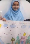 Elsa Jadidi holds a drawing she made in this undated handout photo that has been shared by students and teachers at Wali Ul Asr school to help cope with her death. THE CANADIAN PRESS/HO *MANDATORY CREDIT*