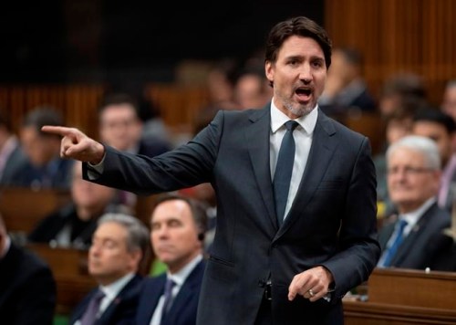 Prime Minister Justin Trudeau gestures as he responds to a question during Question Period in the House of Commons Wednesday March 11, 2020 in Ottawa. Parliamentarians will consider today whether to take the unprecedented move of suspending Parliament because of the COVID-19 pandemic. THE CANADIAN PRESS/Adrian Wyld
