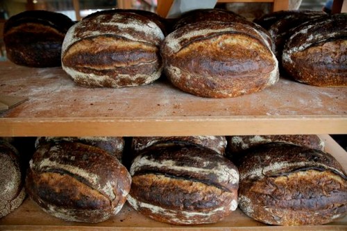 Freshly baked loaves of bread on a rack at the Tartine Manufactory in San Francisco on Friday, Aug. 11, 2017. The time-honoured tradition of baking has become a welcome respite from the stressors of the outside world. THE CANADIAN PRESS/AP, Eric Risberg