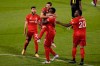 Toronto FC's Pablo Piatti leaps into the arms of Jozy Altidore after Altidore scored a goal as teammates Jonathan Osorio, left, and Ayo Akinola, right, celebrate with them during the second half of an MLS soccer match against the Columbus Crew, Sunday, Sept. 27, 2020, in East Hartford, Conn. (AP Photo/Jessica Hill)