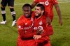 Toronto FC's Richie Laryea, left, and Toronto FC's Alejandro Pozuelo celebrates Pozuelo's goal during the second half of an MLS match against Inter Miami, Sunday, Nov. 1, 2020, in East Hartford, Conn. (AP Photo/Jessica Hill)