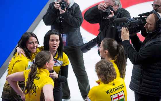 Team Manitoba skip, Kerri Einarson, centre, alternate Jennifer Clark-Rouire, lead Briane Meilleur, second Shannon Birchard and coach Patti Wuthrich celebrate after defeating Team Ontario to win the Scotties Tournament of Hearts in Moose Jaw, Sask., Sunday, February 23, 2020. (Jonathan Hayward / The Canadian Press)