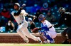 Pittsburgh Pirates' Ke'Bryan Hayes (13) watches his two-run home run during the first inning of a baseball game against the Chicago Cubs Thursday, April 1, 2021, on opening day at Wrigley Field in Chicago. (AP Photo/Paul Beaty)
