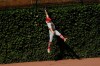 St. Louis Cardinals left fielder Tyler O'Neill misses a double by Chicago Cubs' Ian Happ during the first inning of a baseball game Monday, Sept. 7, 2020, in Chicago. (AP Photo/Paul Beaty)