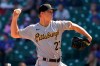 Pittsburgh Pirates starting pitcher Mitch Keller throws against the Chicago Cubs during the first inning of a baseball game in Chicago, Sunday, April 4, 2021. (AP Photo/Nam Y. Huh)