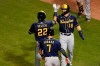 Milwaukee Brewers' Christian Yelich (22) celebrates with teammates Keston Hiura (18) and Eric Sogard (7) after hitting a three-run home run during the sixth inning of a baseball game against the Chicago Cubs, Friday, Aug. 14, 2020, in Chicago. (AP Photo/Jeff Haynes)