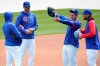 Chicago Cubs third baseman Kris Bryant, second from left, talks to Ian Happ, left, as first baseman Anthony Rizzo shows center fielder Jake Marisnick Wrigley Field during the team's last baseball workout Wednesday, March 31, 2021, before opening day Thursday, April 1, 2021, against the Pittsburgh Pirates in Chicago. (AP Photo/Charles Rex Arbogast)