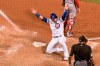 Chicago Cubs Willson Contreras (40) celebrates after scoring on a triple by teammate Jason Heyward during the fourth inning of a baseball game against the St. Louis Cardinals Tuesday, Aug. 18, 2020, in Chicago. (AP Photo/Mark Black)