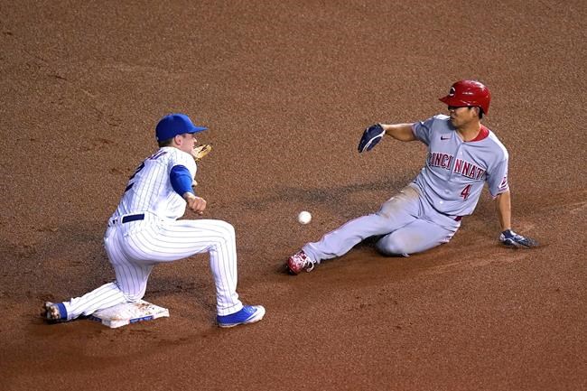 Cincinnati Reds' Shogo Akiyama (4) steals second as Chicago Cubs' Nico Hoerner is unable handle the throw from catcher Willson Contreras during the fourth inning of a baseball game Thursday, Sept. 10, 2020, in Chicago. (AP Photo/Charles Rex Arbogast)