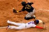 Chicago Cubs' Albert Almora Jr. (5) slides safely into home plate as Milwaukee Brewers catcher Omar Narvaez (10) catches the throw during the tenth inning of a baseball game Saturday, Aug. 15, 2020, in Chicago. Milwaukee won 6-5 in ten innings. (AP Photo/Paul Beaty)