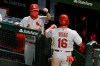 St. Louis Cardinals' Kolten Wong (16) is congratulated after scoring on a single by Paul Goldschmidt during the fifth inning of a baseball game against the Chicago Cubs on Tuesday, Aug. 18, 2020, in Chicago. (AP Photo/Mark Black)