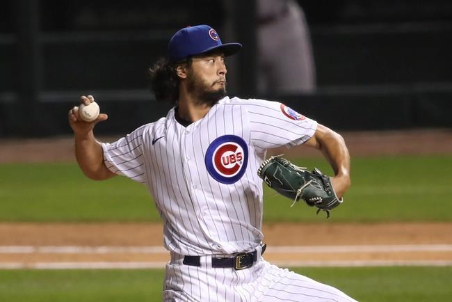 Chicago Cubs starting pitcher Yu Darvish delivers to a Cincinnati Reds batter during the third inning of a baseball game Wednesday, Sept. 9, 2020, in Chicago. (AP Photo/Kamil Krzaczynski)