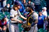 Milwaukee Brewers relief pitcher Josh Hader, left, celebrates with catcher Omar Narvaez after they defeated the Chicago Cubs in a baseball game in Chicago, Saturday, April 24, 2021. (AP Photo/Nam Y. Huh)