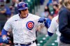 Chicago Cubs' Anthony Rizzo, left, smiles as he celebrates with Joc Pederson after hitting a solo home run during the first inning of a baseball game against the Atlanta Braves in Chicago, Sunday, April 18, 2021. (AP Photo/Nam Y. Huh)