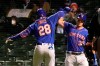 New York Mets' J.D. Davis (28) celebrates his home run off Chicago Cubs starting pitcher Jake Arrieta with James McCann (33) during the fifth inning of a baseball game Tuesday, April 20, 2021, in Chicago. (AP Photo/Charles Rex Arbogast)