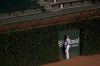 Chicago Cubs center fielder Ian Happ (8) watches a home run ball off the bat of Chicago White Sox's Yasmani Grandal clear the wall during the ninth inning of a baseball game Saturday, Aug. 22, 2020, in Chicago. (AP Photo/Jeff Haynes)