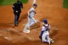 Minnesota Twins' Josh Donaldson, center, crosses home plate after hitting a solo home run off Chicago Cubs relief pitcher Dan Winkler during the ninth inning of a baseball game, Saturday, Sept. 19, 2020, in Chicago. (AP Photo/Kamil Krzaczynski)