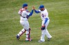 Chicago Cubs relief pitcher Jeremy Jeffress, right, celebrates with catcher Victor Caratini, left, after delivering final out against the Chicago White Sox during the ninth inning of a baseball game, Sunday, Aug. 23, 2020, in Chicago. (AP Photo/Kamil Krzaczynski)