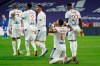 Lyon's Memphis Depay, right, celebrates his goal against Strasbourg during the French League One soccer match between Lyon and Strasbourg, in Decines, near Lyon, central France, Saturday, Feb. 6, 2021. (AP Photo/Laurent Cipriani)