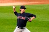 Cleveland Indians starting pitcher Shane Bieber delivers during the first inning of the team's baseball game against the Chicago White Sox on Friday, April 30, 2021, in Chicago. (AP Photo/Charles Rex Arbogast)