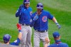 Chicago Cubs' Kris Bryant, top right, is congratulated by teammates after hitting a solo home run during the second inning of a baseball game against the Chicago White Sox in Chicago, Sunday, Sept. 27, 2020. (AP Photo/Nam Y. Huh)